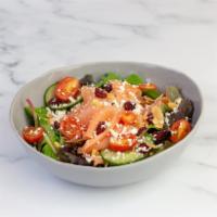 Smoked Salmon Salad · Toasted almonds, dried cranberries, grape tomatoes, radishes, and cucumbers with Ginger Dres...