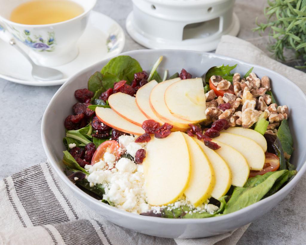 Apple Cranberry Walnut Salad · Red apple, green apple, toasted walnuts, dried cranberries, feta cheese, and grape tomato with apple vinaigrette.