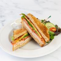 Turkey Club Sandwich · Turkey breast, bacon, swiss cheese, tomato, lettuce and mayo.  Comes with House Salad