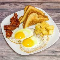 El Americano · 2 eggs any style, served with sausage or bacon and 2 slices of toast.