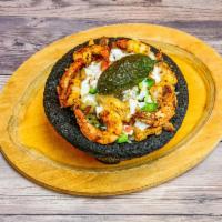 Molcajete · Grilled beef and chicken fajita, shrimps, with sauteed onions, jalapenos, salsa, and mozzare...