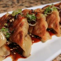 Pork Gyoza · Fried or steamed. Choice of chili oil, sweet chili, or eel sauce.