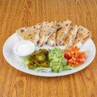Quesadilla · 2 flour tortillas stuffed with melted Jack cheese and your choice of meat.
