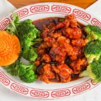General Tso's Chicken · Breaded, fried with tangerine spicy garlic sauce, served with broccoli . Hot and spicy.