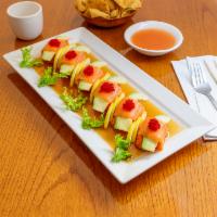 Miracle Roll · Spicy tuna wrapped with avocado and fresh salmon in ponzu sauce (no rice).