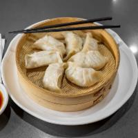 Mandu 만두  · Meat Dumpling Thinly rolled flour dough
folded and filled with ground meat and
vegetables. T...