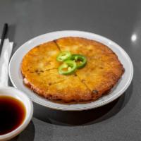 Bindae-Tteok 빈대떡 · Mung Bean Pancake This is one of the
mandatory dishes on traditional holidays or
special fes...