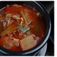 Gukbap 국밥 · Beef and Rice Soup This dish is made by
boiling cow leg bones to make a clear broth.
The bon...