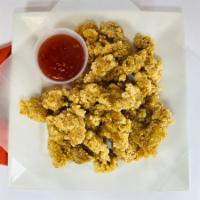 Popcorn Chicken · Tender, lightly breaded bite size chicken pieces deep fried to perfection. Our most popular ...