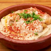 Hummus · Served with whole chickpeas, spices, and extra virgin olive oil. Gluten free and vegan. Serv...