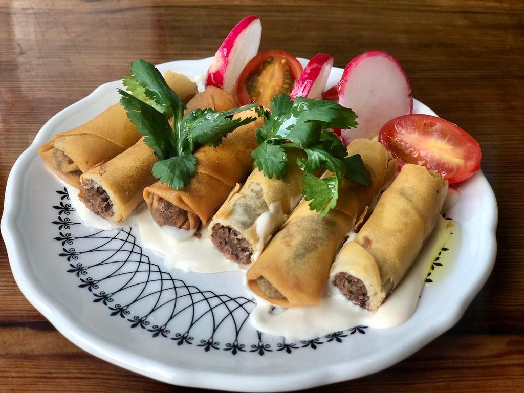 Cigars · Homemade filled with ground beef, served with fava.