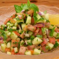 Mediterranean Chopped Salad · Tomato, cucumber, onion, parsley and mint mixed with lemon and extra virgin olive oil. Vegan...