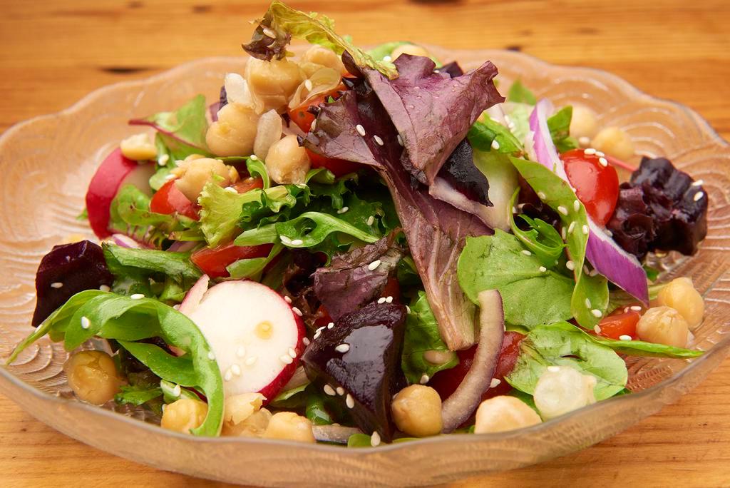 Maya Salad · Organic mixed greens with beets, cherry tomatoes, red onion, warm chickpeas, and thin-sliced radish, sprinkled with sesame and mixed with balsamic vinaigrette. Vegan and gluten-free.