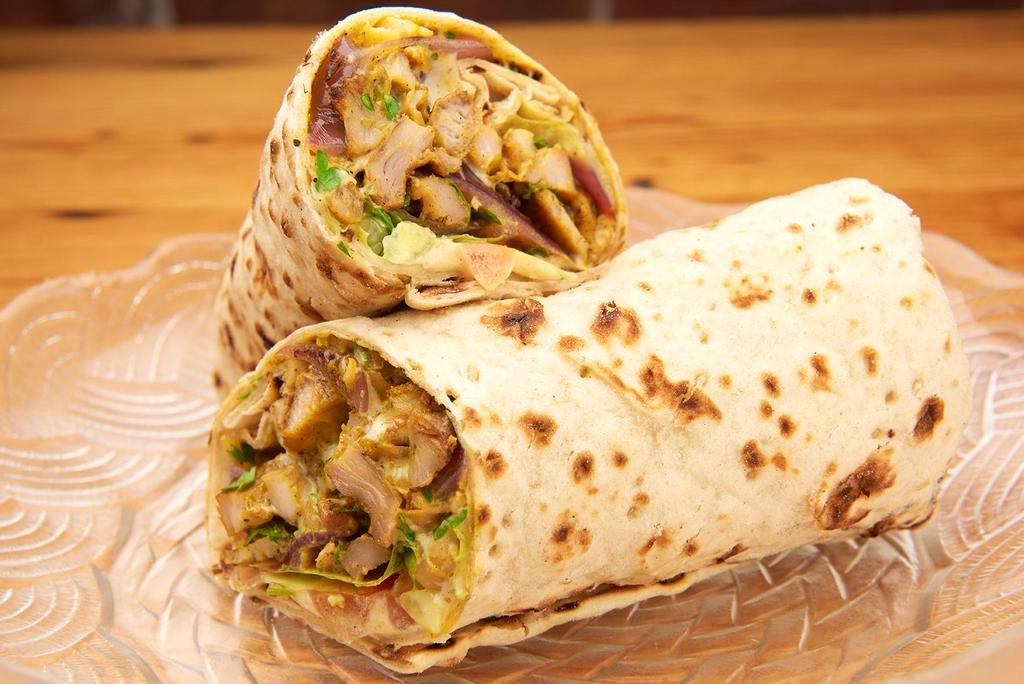 Shawarma Laffa · Thinly sliced chicken with grilled onion, hummus, chopped salad and lettuce.