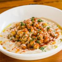 Chickpea Hummus · Hummus topped with whole chickpeas, parsley, paprika and extra virgin olive oil. Served with...