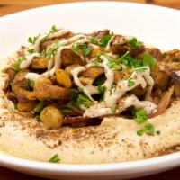 Shawarma Hummus · Thinly sliced chicken and grilled onions. Topped with parsley, paprika, and extra virgin oli...