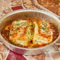 Lasagna with Meat Sauce · Layers of pasta, ricotta, mozzarella cheese and bolognese sauce.