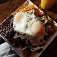 Chilaquiles Breakfast · green salsa, fried tortilla, cheese, sour cream, choice of meat, and 2 fried eggs rice, and ...