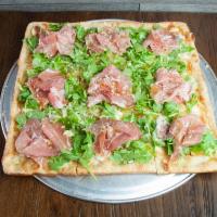 7. Prosciutto Arugula Pizza · Grande mozzarella, caramelized onions, goat cheese, prosciutto and arugula, topped with Parm...