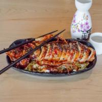 Grilled Whole Squid · A crowd favorite! Grilled squid topped with our homemade sweet and spicy sauce and toasted s...
