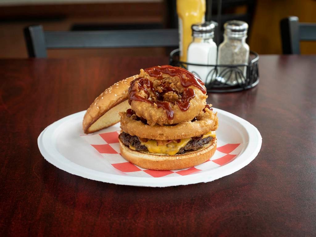 Rodeo Burger · Cheddar cheese, bacon, onion rings and BBQ sauce.