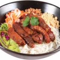 51. Lemongrass Pork Vermicelli · Charbroiled pork slices marinated in lemongrass and garlic.  Served over a bed of rice vermi...