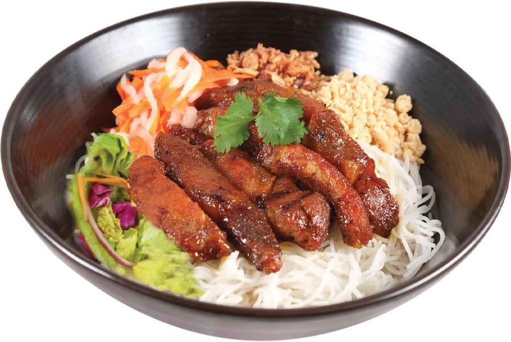 51. Lemongrass Pork Vermicelli · Charbroiled pork slices marinated in lemongrass and garlic.  Served over a bed of rice vermicelli noodles with fresh vegetables and crushed peanuts