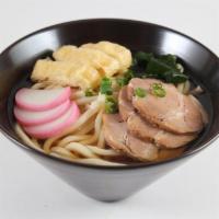 6. Udon Soup · Japanese fish cake, pork slices, tofu, seaweed, green onion, and udon noodles.