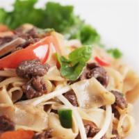 23. Drunken Noodles · Choice of protein, rice noodles, bean sprouts, bell pepper, jalapeno, carrot, mushroom, toma...