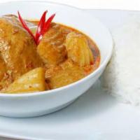 42. Yellow Curry · Choice of protein, onions and potato in yellow curry.