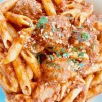 64. Penne Meat Lovers · Penne pasta with Italian mild sausages & beef meatballs in homemade meat sauce