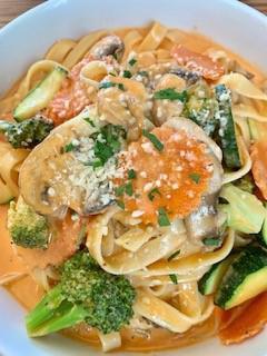 Fettuccine Primavera · Fettuccine pasta, carrots, mushrooms, carrots & zucchini in pink sauce, topped with parmesan cheese