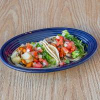 Veggie Taco · 2 tacos. A corn tortilla with potato, carrots, mushrooms, pico de gallo, and lettuce.
