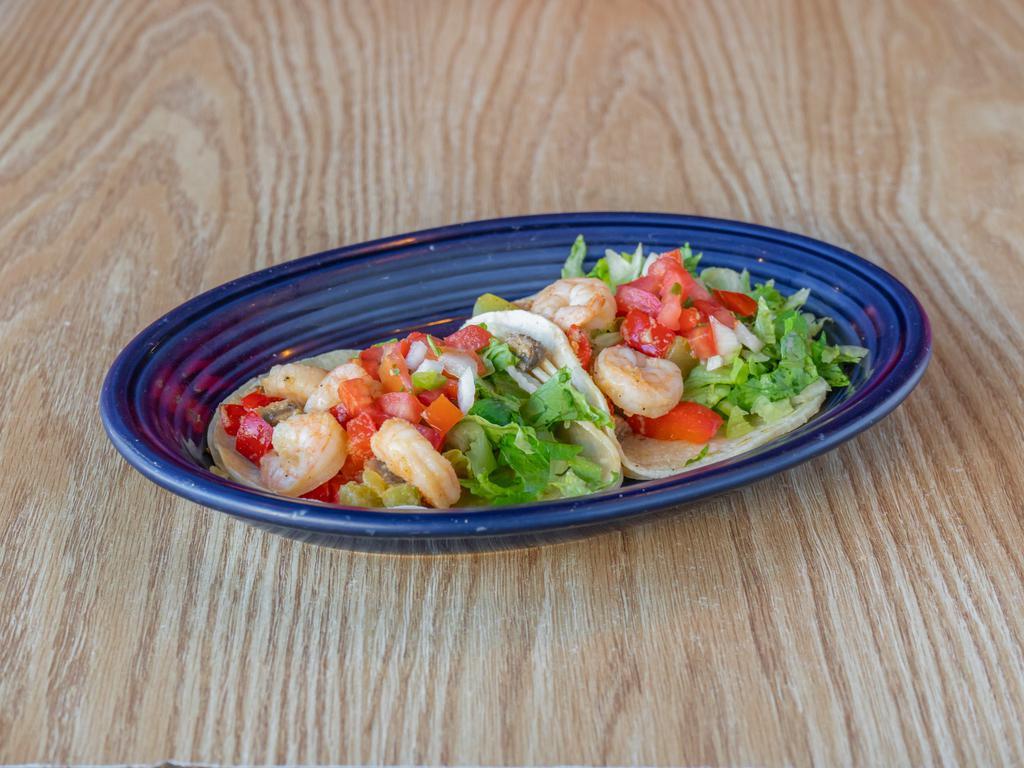 Camarones Taco · 2 tacos. Shrimp sautéed with mushrooms and bell pepper in white wine on a corn tortilla with pico de gallo and lettuce.