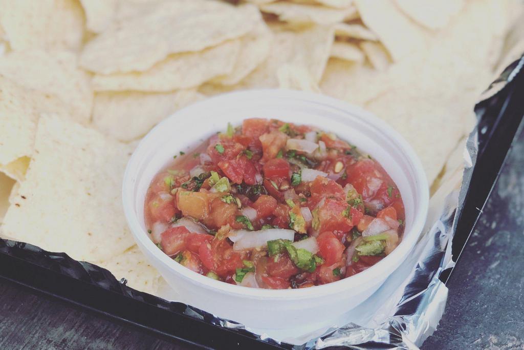 Chips And Salsa. · Fresh corn tortillas with roasted tomato salsa. Queso and Guacamole or Trio for an extra charge.