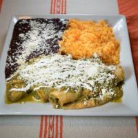 32. Enchiladas · Corn roll tortilla with chicken or steak or cheese, red or green sauce. Served with rice and...
