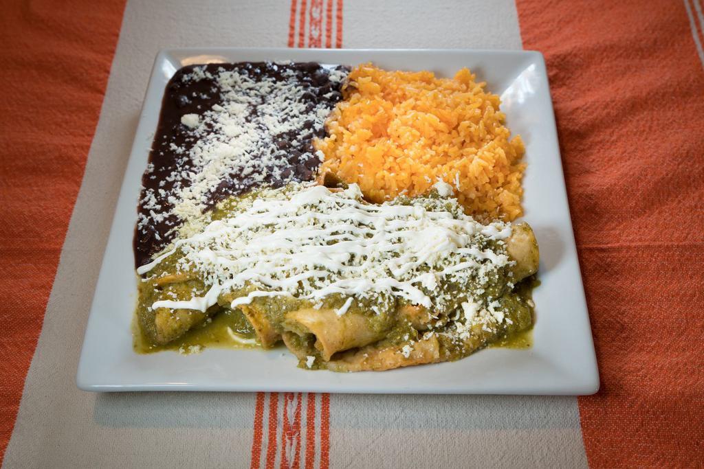 32. Enchiladas · Corn roll tortilla with chicken or steak or cheese, red or green sauce. Served with rice and beans.