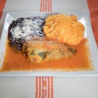 45. Chiles Rellenos de Pollo · Queso chili peppers stuffed with chicken and cheese. Served with rice and beans.
