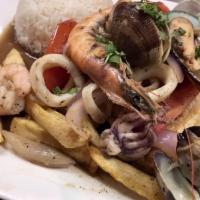 Saltado de Mariscos · Assorted seafood, onions, tomatoes sauteed and seasoned in our fire woks. Served with french...