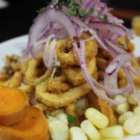 Cevi Chios · White fish marinated in lime juice and Peruvian chiles topped with fired calamari and served...
