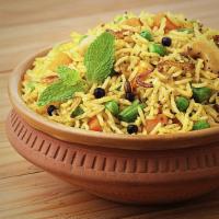 Veggie Dum Biryani · Long grain basmati rice cooked with combo of fresh vegetables, tossed herbs, and exotic spic...