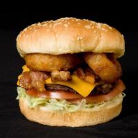 4. Cowboy Burger · 1/4 lb Patty, Lettuce, Tomato, Bacon, Onion Rings, Cheddar Cheese and BBQ Sauce.