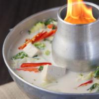 Thai Coconut Milk Soup · Thai style coconut milk soup served with mushrooms, green onions, chili oil and your choice ...