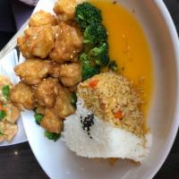 Tangerine Tofu · Breaded crispy tofu mixed with our house tangerine sauce, served with steamed broccoli and r...
