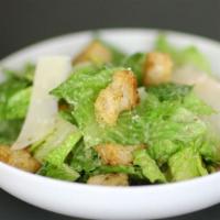 Caesar Salad · Chopped romaine lettuce tossed with Caesar dressing, croutons, and Parmesan cheese. Add prot...
