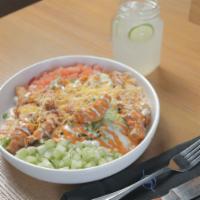 Buffalo Chicken Salad · Iceberg and romaine lettuce topped with Buffalo chicken strips, cucumber, tomato, cheese mix...