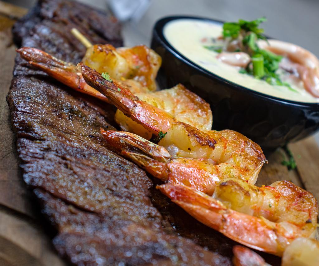 Mar and Tierra · Skirt steak with shrimp seafood sauce.