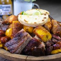 Nando’s Platter for Sharing · Steak Llanera, pork ribs, boiled potatoes, ripe plantains, yellow potatoes, pork skin, pork ...