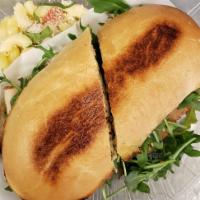 Turkey Arugula Sandwich on Ciabatta  · Smoked turkey breast, Fat tomatoes, mozzarella cheese, fresh arugula, crispy onions and pest...