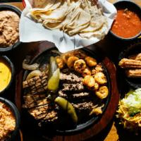 Fajita Trio · Indecisive eaters, rejoice. Chicken, beef and shrimp fajitas and a side of Pete’s famous whi...